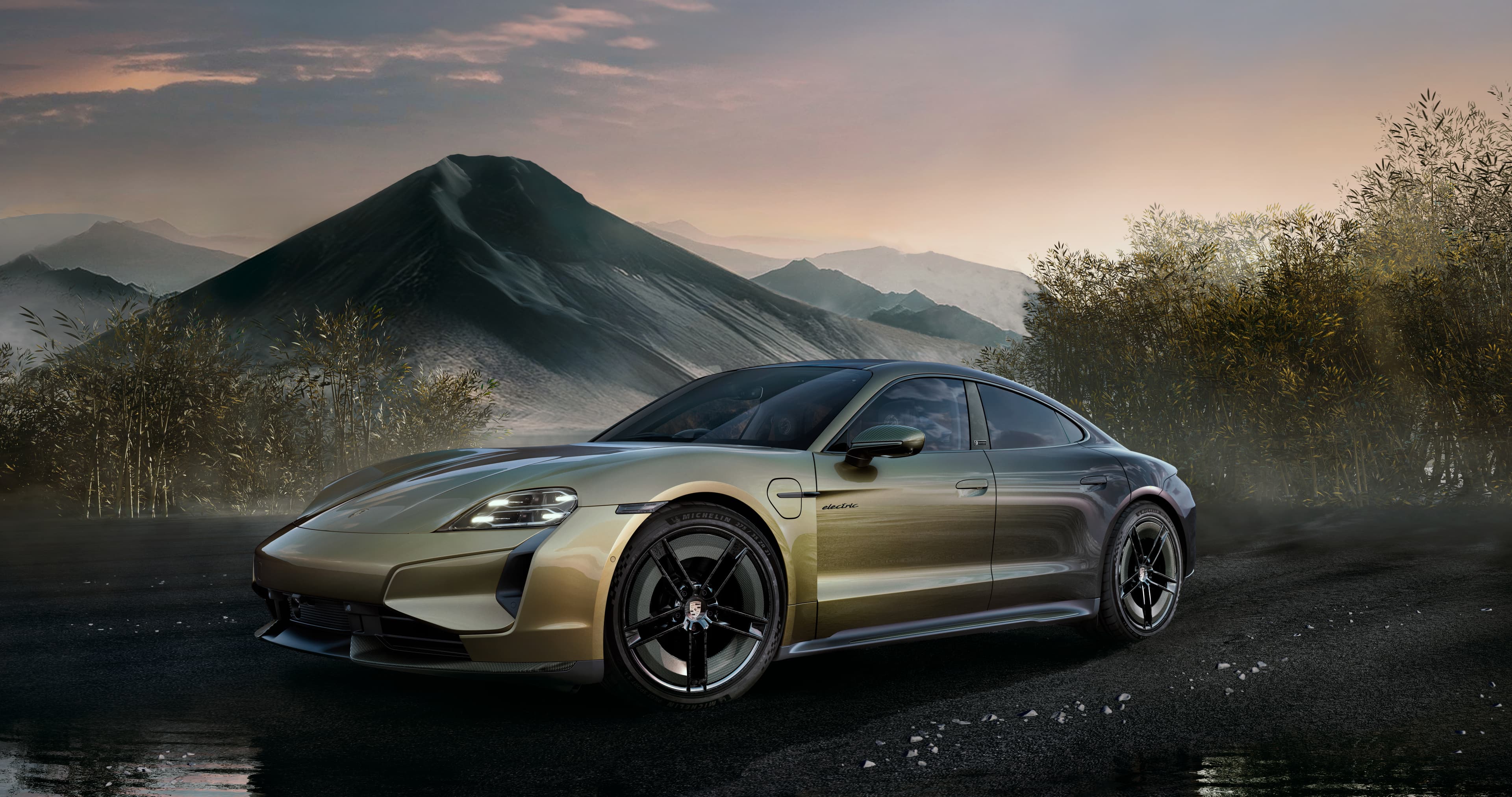 A sleek, metallic porsche taycan parked on a dark, wet road with a mountainous landscape and cloudy sky in the background.